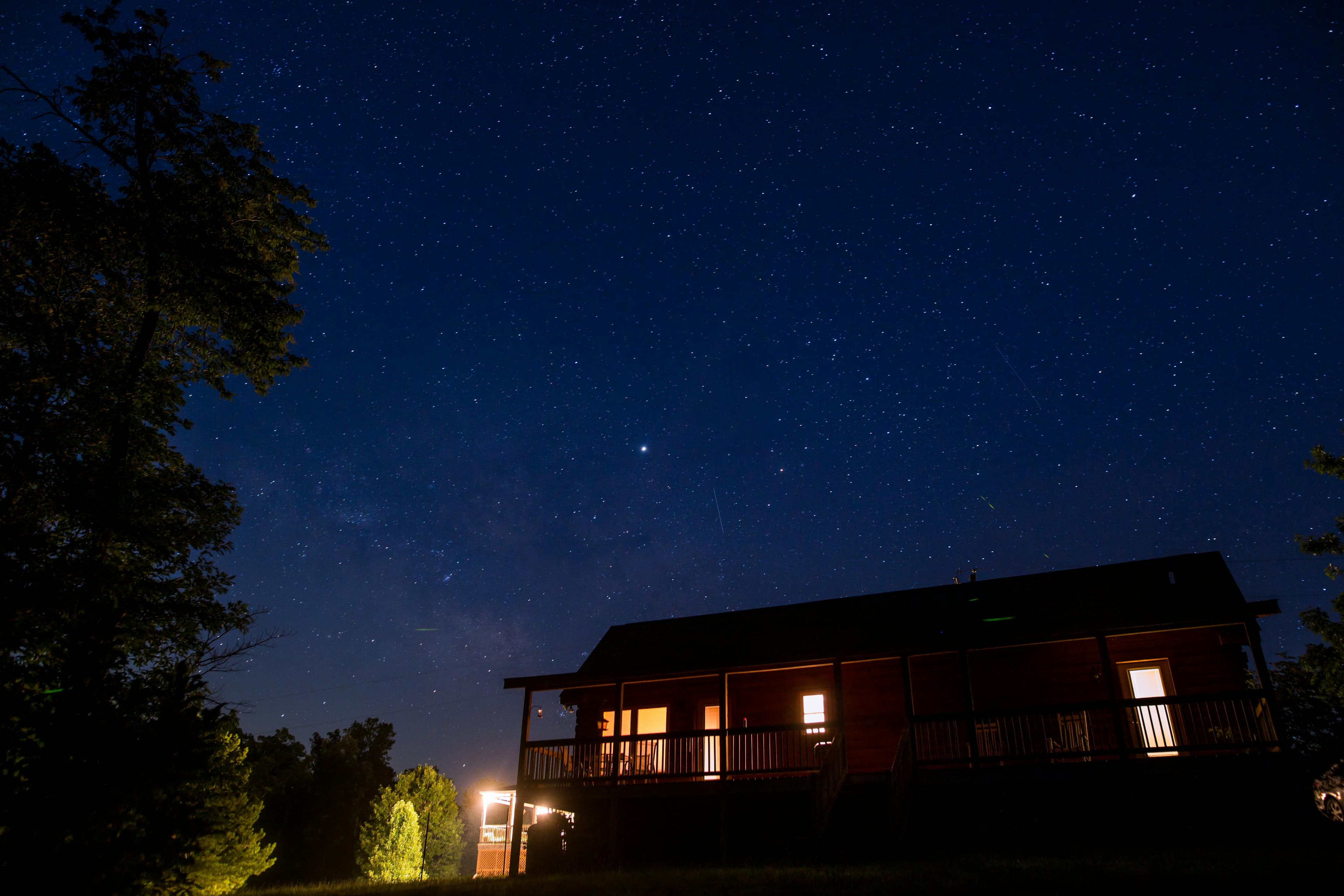 Starry night sky over sleeping baby